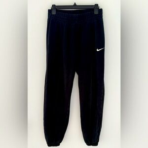 Women’s Nike Black Sweat Pants with White Swoosh and ribbed bottoms size S.